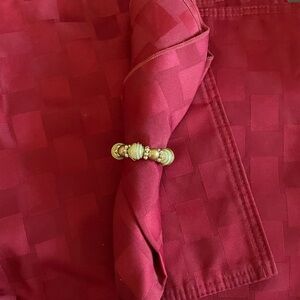 EUC Set of 6 burgundy silky material place mats  with pearl like napkin rings.